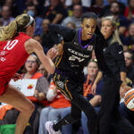 Sep 25, 2024; Uncasville, Connecticut, USA; Connecticut Sun guard DeWanna Bonner (24) drives to the basket defended by Indiana Fever guard Lexie Hull (10) during the second half during game two of the first round of the 2024 WNBA Playoffs at Mohegan Sun Arena.