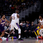 PALM SPRINGS, CALIFORNIA - OCTOBER 06: LeBron James #23 of the Los Angeles Lakers sets a screen for Bronny James #9 against Tyus Jones #21 of the Phoenix Suns during the second quarter at Acrisure Arena on October 06, 2024 in Palm Springs, California. NOTE TO USER: User expressly acknowledges and agrees that, by downloading and/or using this photograph, user is consenting to the terms and conditions of the Getty Images License Agreement. (Photo by Katelyn Mulcahy/Getty Images)
