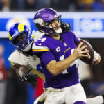INGLEWOOD, CALIFORNIA - OCTOBER 24: Jared Verse (L) #8 of the Los Angeles Rams sacks Sam Darnold #14 of the Minnesota Vikings for a safety during the second half at SoFi Stadium on October 24, 2024 in Inglewood, California.