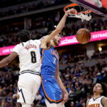 DENVER, COLORADO - OCTOBER 24: Chet Holmgren #7 of the Oklahoma City Thunder dunks on Peyton Watson #8 of the Denver Nuggets in the third quarter at Ball Arena on October 24, 2024 in Denver, Colorado. NOTE TO USER: User expressly acknowledges and agrees that, by downloading and or using this photograph, User is consenting to the terms and conditions of the Getty Images License Agreement. (Photo by Matthew Stockman/Getty Images)