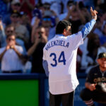 Jul 19, 2022; Los Angeles, California, USA; Los Angeles Dodgers former pitcher Fernando Valenzuela waves to the crowd before throwing a ceremonial first pitch before the 2022 MLB All Star Game at Dodger Stadium. Mandatory Credit: Robert Hanashiro-USA TODAY Sports