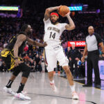 Mar 28, 2023; San Francisco, California, USA; New Orleans Pelicans small forward Brandon Ingram (14) controls the ball against Golden State Warriors center Draymond Green (23) during the fourth quarter at Chase Center.