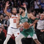 Oct 25, 2023; New York, New York, USA; Boston Celtics forward Jayson Tatum (0) is guarded by New York Knicks guard Jalen Brunson (11) while trying to make a pass in the fourth quarter at Madison Square Garden.
