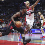 Nov 3, 2023; Miami, Florida, USA; NBA; Miami Heat forward Jimmy Butler (22) drives to the basket against Washington Wizards forward Kyle Kuzma (33) during the third quarter at Kaseya Center.