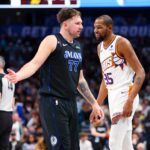 Jan 24, 2024; Dallas, Texas, USA; Phoenix Suns forward Kevin Durant (35) laughs in front of Dallas Mavericks guard Luka Doncic (77) during the third quarter against the Dallas Mavericks at American Airlines Center.