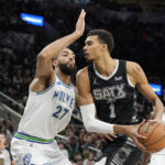 Jan 27, 2024; San Antonio, Texas, USA; San Antonio Spurs forward Victor Wembanyama (1) drives to the basket against the Minnesota Timberwolves center Rudy Gobert (27) during the first half at Frost Bank Center.