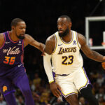 Feb 25, 2024; Phoenix, Arizona, USA; NBA; Los Angeles Lakers forward LeBron James (23) against Phoenix Suns forward Kevin Durant (35) at Footprint Center.