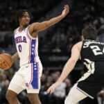 Mar 14, 2024; Milwaukee, Wisconsin, USA; Philadelphia 76ers guard Tyrese Maxey (0) gestures during the fourth quarter against the Milwaukee Bucks at Fiserv Forum.