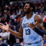 Mar 25, 2024; Denver, Colorado, USA; Memphis Grizzlies forward Jaren Jackson Jr. (13) reacts after a call in the third quarter against the Denver Nuggets at Ball Arena.