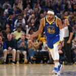 Apr 2, 2024; San Francisco, California, USA; Golden State Warriors guard Moses Moody (4) reacts after making a three point basket against the Dallas Mavericks in the second quarter at the Chase Center. Mandatory Credit: Cary Edmondson-USA TODAY Sports