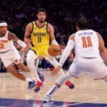 May 19, 2024; New York, New York, USA; Indiana Pacers guard Tyrese Haliburton (0) controls the ball against New York Knicks guards Miles McBride (2) and Jalen Brunson (11) during the first quarter of game seven of the second round of the 2024 NBA playoffs at Madison Square Garden. Mandatory Credit: Brad Penner-USA TODAY Sports
