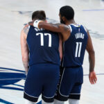 May 26, 2024; Dallas, Texas, USA; Dallas Mavericks guard Luka Doncic (77) and Dallas Mavericks guard Kyrie Irving (11) hug during the fourth quarter against the Minnesota Timberwolves during game three of the western conference finals for the 2024 NBA playoffs at American Airlines Center.
