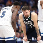 May 28, 2024; Dallas, Texas, USA; NBA; Minnesota Timberwolves guard Anthony Edwards (5) speaks to Dallas Mavericks guard Luka Doncic (77) during the fourth quarter of game four of the western conference finals for the 2024 NBA playoffs at American Airlines Center.