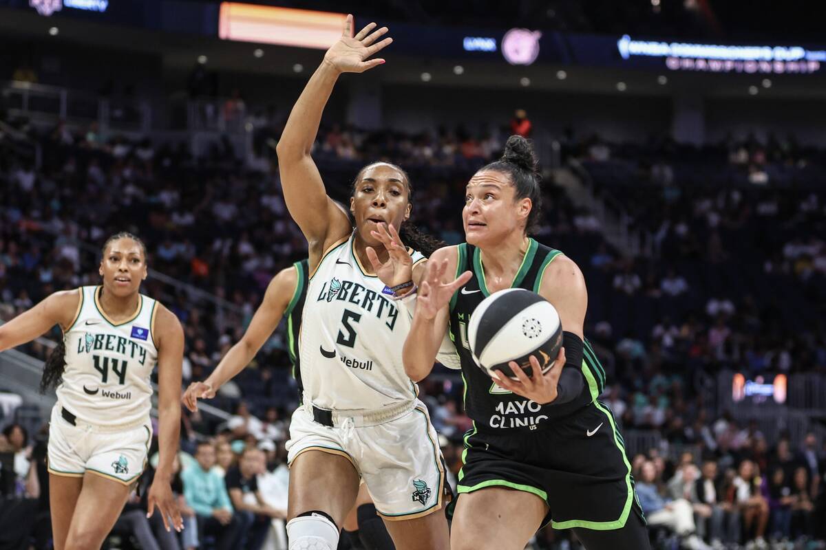 Jun 25, 2024; Belmont Park, New York, USA; Minnesota Lynx guard Kayla McBride (21) dribbles past New York Liberty forward Kayla Thornton (5) in the first quarter of the Commissioner’s Cup Championship game at UBS Arena, WNBA.