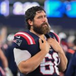 August 8, 2024; Foxborough, MA, USA; New England Patriots center David Andrews (60) watches from the sideline during the first half against the Carolina Panthers at Gillette Stadium. Mandatory Credit: Eric Canha-USA TODAY Sports
