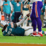 Sep 12, 2024; Miami Gardens, Florida, USA; Miami Dolphins quarterback Tua Tagovailoa (1) reacts after an apparent injury against the Buffalo Bills during the third quarter at Hard Rock Stadium. Mandatory Credit: Sam Navarro-Imagn Images