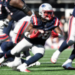 Sep 15, 2024; Foxborough, Massachusetts, USA; New England Patriots running back Rhamondre Stevenson (38) runs with the ball against the Seattle Seahawks during the second half at Gillette Stadium. Mandatory Credit: Brian Fluharty-Imagn Images