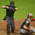 MLB - Sep 17, 2024; Cleveland, Ohio, USA; Umpire Junior Valentine (25) calls a third strike during a game between the Cleveland Guardians and the Kansas City Royals at Progressive Field. Mandatory Credit: David Richard-Imagn Images