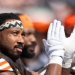 Sep 22, 2024; Cleveland, Ohio, USA; Cleveland Browns defensive end Myles Garrett (95) claps while watching the game from the bench during the second quarter against the New York Giants at Huntington Bank Field. Mandatory Credit: Scott Galvin-Imagn Images
