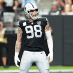 Sep 22, 2024; Paradise, Nevada, USA; Las Vegas Raiders defensive end Maxx Crosby (98) celebrates after getting a sack against the Carolina Panthers during the second quarter at Allegiant Stadium. Mandatory Credit: Stephen R. Sylvanie-Imagn Images