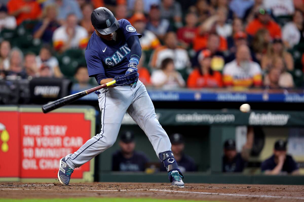 Sep 25, 2024; Houston, Texas, USA; Seattle Mariners second baseman Jorge Polanco (7) hits a single against the Houston Astros during the second inning at Minute Maid Park. Mandatory Credit: Erik Williams-Imagn Images
