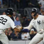 Sep 26, 2024; Bronx, New York, USA; New York Yankees center fielder Aaron Judge (99) celebrates with right fielder Juan Soto (22) after hitting a two run home run during the seventh inning against the Baltimore Orioles at Yankee Stadium. Mandatory Credit: Vincent Carchietta-Imagn Images