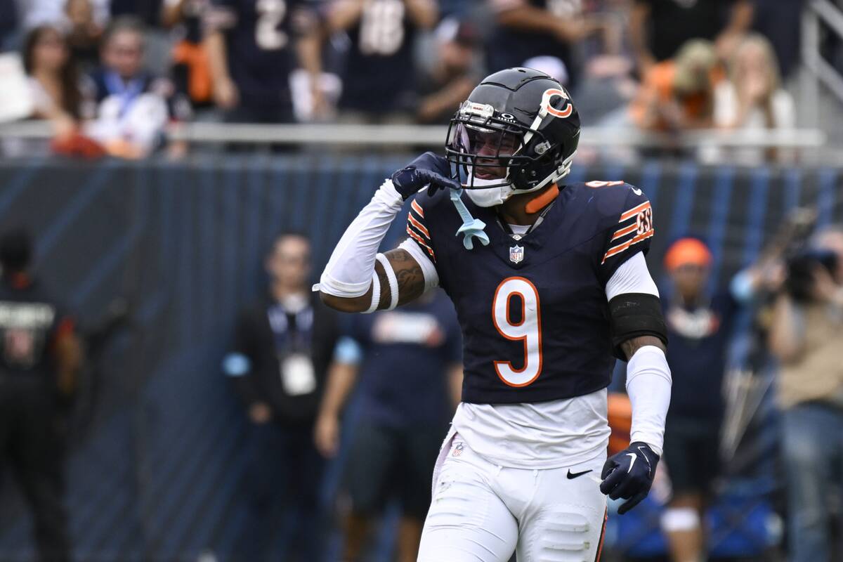 Sep 29, 2024; Chicago, Illinois, USA; Chicago Bears safety Jaquan Brisker (9) after sacking Los Angeles Rams linebacker Jared Verse (8) during the second half at Soldier Field. Mandatory Credit: Matt Marton-Imagn Images