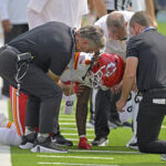 Sep 29, 2024; Inglewood, California, USA; Kansas City Chiefs wide receiver Rashee Rice (4) pounds his fist on the ground after an injury in the first half against the Los Angeles Chargers at SoFi Stadium.