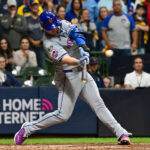 Oct 3, 2024; Milwaukee, Wisconsin, USA; New York Mets first baseman Pete Alonso (20) hits a three run home run against the Milwaukee Brewers in the ninth inning during game three of the Wildcard round for the 2024 MLB Playoffs at American Family Field. Mandatory Credit: Benny Sieu-Imagn Images