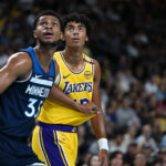 lOct 4, 2024; Palm Desert, California, USA; Minnesota Timberwolves guard PJ Dozier (35) and Los Angeles Lakers guard Max Christie (12) watch the free throw during the first half at Acrisure Arena.