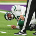Oct 6, 2024; Tottenham, ENG; New York Jets quarterback Aaron Rodgers (8) suffers an injury after a tackle from Minnesota Vikings Linebacker Patrick Jones II (91) in the 3rd Quarter at Tottenham Hotspur Stadium. Mandatory Credit: Shaun Brooks-Imagn Images