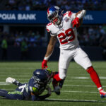 Oct 6, 2024; Seattle, Washington, USA; New York Giants running back Tyrone Tracy Jr. (29) breaks a tackle attempt by Seattle Seahawks safety Julian Love (20) during the second quarter at Lumen Field. Mandatory Credit: Joe Nicholson-Imagn Images | NFL: New York Giants at Seattle Seahawks