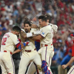 Oct 6, 2024; Philadelphia, Pennsylvania, USA; Philadelphia Phillies outfielder Nick Castellanos (8) celebrates with teammates after defeating the New York Mets during game two of the NLDS for the 2024 MLB Playoffs at Citizens Bank Park. Mandatory Credit: Kyle Ross-Imagn Images