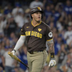 Oct 6, 2024; Los Angeles, California, USA; San Diego Padres third baseman Manny Machado (13) reacts after striking out in the sixth inning against the Los Angeles Dodgers during game two of the NLDS for the 2024 MLB Playoffs at Dodger Stadium. Mandatory Credit: Jayne Kamin-Oncea-Imagn Images