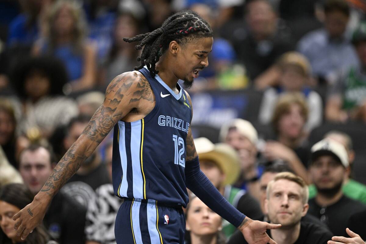 Oct 7, 2024; Dallas, Texas, USA; Memphis Grizzlies guard Ja Morant (12) walks off the court after he appears to suffer another lower body injury during the second half against the Dallas Mavericks at the American Airlines Center. Mandatory Credit: Jerome Miron-Imagn Images