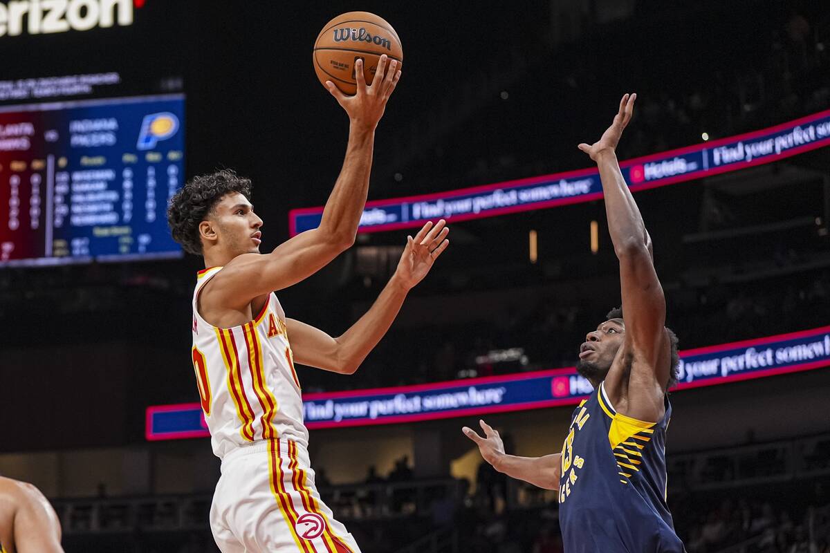 Oct 8, 2024; Atlanta, Georgia, USA; Atlanta Hawks forward Zaccharie Risacher (10) drives to the basket against Indiana Pacers center James Wiseman (13) during the first half at State Farm Arena. Mandatory Credit: Dale Zanine-Imagn Images