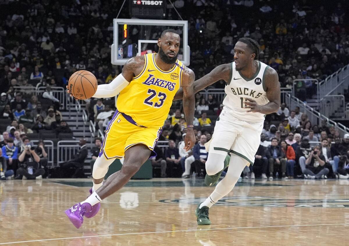 Oct 10, 2024; Milwaukee, Wisconsin, USA; Los Angeles Lakers forward LeBron James (23) drives to the basket against Milwaukee Bucks forward Taurean Prince (12) in the first half at Fiserv Forum. Mandatory Credit: Michael McLoone-Imagn Images