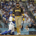 Oct 11, 2024; Los Angeles, California, USA; San Diego Padres first baseman Luis Arraez (4) reacts at bat in the sixth inning against the Los Angeles Dodgers during game five of the NLDS for the 2024 MLB Playoffs at Dodger Stadium. Mandatory Credit: Jayne Kamin-Oncea-Imagn Images