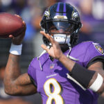 Oct 13, 2024; Baltimore, Maryland, USA; Baltimore Ravens quarterback Lamar Jackson (8) warms up prior to the game against the Washington Commanders at M&T Bank Stadium. Mandatory Credit: Mitch Stringer-Imagn Images
