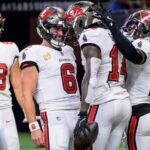 Oct 13, 2024; New Orleans, Louisiana, USA; Tampa Bay Buccaneers quarterback Baker Mayfield (6) celebrates the touchdown reception of Tampa Bay Buccaneers wide receiver Chris Godwin (14) during the first quarter against the New Orleans Saints at Caesars Superdome.