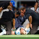 Oct 13, 2024; Arlington, Texas, USA; Detroit Lions defensive end Aidan Hutchinson (97) is injured during a sack against the Dallas Cowboys during the third quarter at AT&T Stadium.