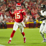 Oct 7, 2024; Kansas City, Missouri, USA; Kansas City Chiefs quarterback Patrick Mahomes (15) throws a pass against New Orleans Saints defensive end Cameron Jordan (94) and defensive end Carl Granderson (96) during the first half at GEHA Field at Arrowhead Stadium. Mandatory Credit: Jay Biggerstaff-Imagn Images
