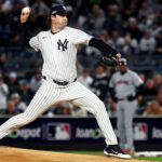 Oct 15, 2024; Bronx, New York, USA; New York Yankees pitcher Gerrit Cole (45) throws a pitch during the first inning against the Cleveland Guardians in game two of the ALCS for the 2024 MLB Playoffs at Yankee Stadium. Mandatory Credit: Vincent Carchietta-Imagn Images