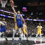 Oct 15, 2024; Las Vegas, Nevada, USA; Golden State Warriors guard Stephen Curry (30) is blocked by Los Angeles Lakers forward Anthony Davis (3) in the second quarter at T-Mobile Arena.