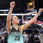 Oct 16, 2024; Minneapolis, Minnesota, USA; New York Liberty guard Sabrina Ionescu (20) celebrates her teams win after game three of the 2024 NBA Finals against the Minnesota Lynx at Target Center.