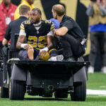 Oct 17, 2024; New Orleans, Louisiana, USA; New Orleans Saints cornerback Paulson Adebo (29) leaves the field with an injury during the second quarter against the Denver Broncos at Caesars Superdome. Mandatory Credit: Matthew Hinton-Imagn Images