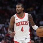 Oct 17, 2024; Houston, Texas, USA; Houston Rockets guard Jalen Green (4) dribbles against the San Antonio Spurs in the fourth quarter at Toyota Center.