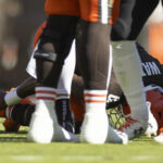 Oct 20, 2024; Cleveland, Ohio, USA; Cleveland Browns quarterback Deshaun Watson (4) holds his ankle from a torn Achilles during the second quarter against the Cincinnati Bengals at Huntington Bank Field. Mandatory Credit: Scott Galvin-Imagn Images