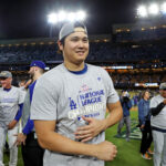 Oct 20, 2024; Los Angeles, California, USA; Los Angeles Dodgers two-way player Shohei Ohtani (17) celebrates after beating the New York Mets during game six of the NLCS for the 2024 MLB playoffs at Dodger Stadium. Mandatory Credit: Kiyoshi Mio-Imagn Images