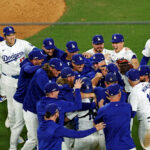 Oct 20, 2024; Los Angeles, California, USA; The Los Angeles Dodgers celebrate after beating the New York Mets in game six of the NLCS for the 2024 MLB playoffs at Dodger Stadium. Mandatory Credit: Kiyoshi Mio-Imagn Images